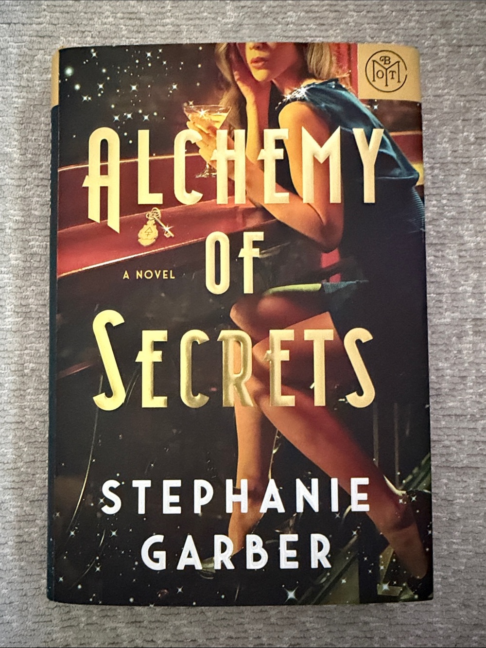 Alchemy of Secrets by Stephanie Garber - Hardcover Book - Gold & Black Cover